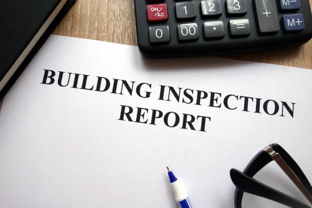 istock Building inspection report, pen, glasses and calculator 1081551426