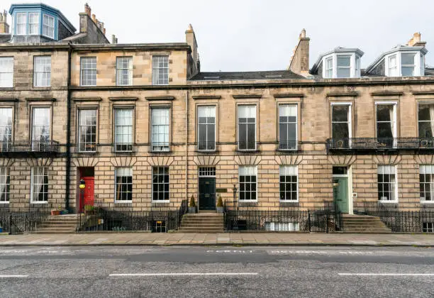 Photo of Row of Traditional Terraced Houses along a Street in a City Centre