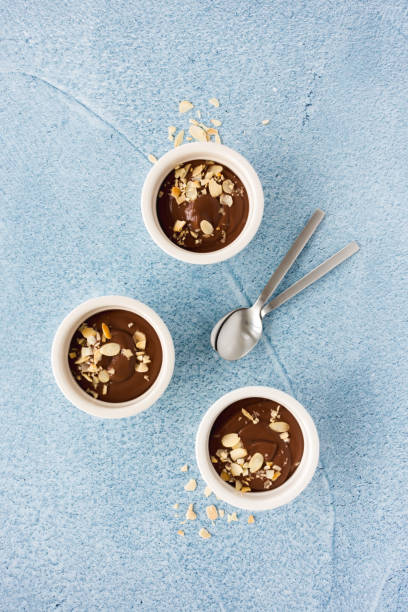 istock Homemade Chocolate Pudding in Ramekins on Blue 1081561716