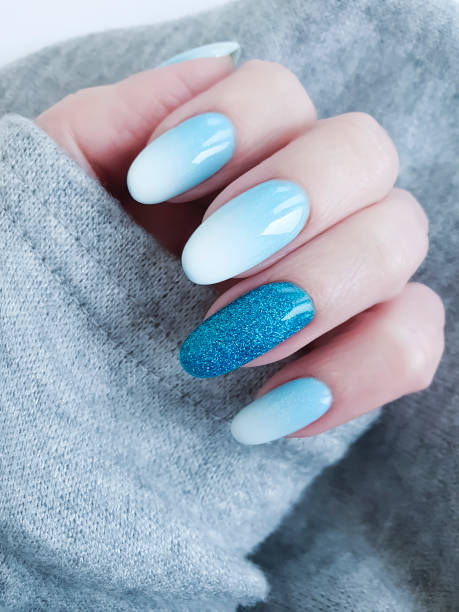 istock female hand beautiful manicure, sweater 1081562394