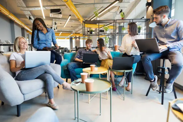 Photo of Young coworkers in modern office