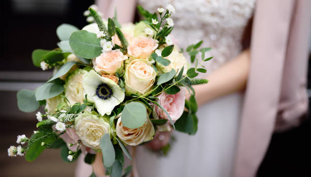 istock Bride holding stylish wedding flowers bouquet 1081568106