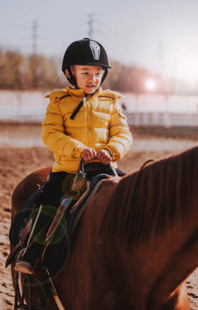 istock Kid Riding A Horse 1081569448