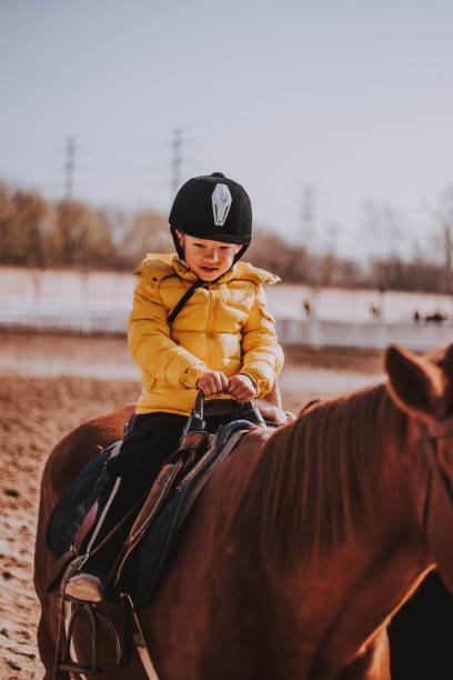 istock Kid Riding A Horse 1081569530