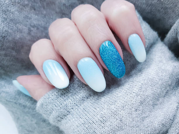 istock female hand beautiful manicure, sweater 1081575008