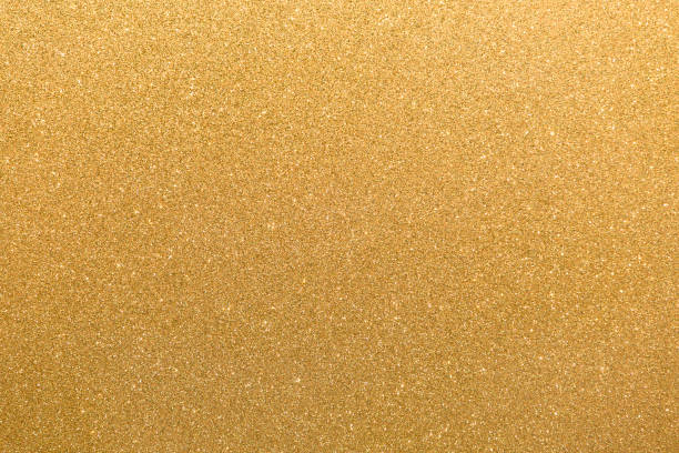 istock Golden glitter orange yellow surface with blinking white irregular spots, copy space background. 1081578658