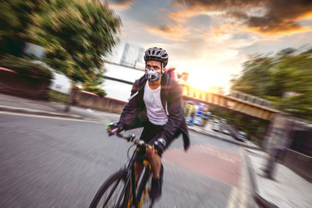 Cyclist commuter wearing a pollution-mask in Central London