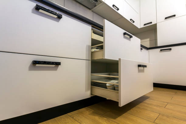istock Open kitchen drawers with plates and cups dishes 1081585810