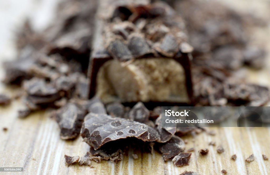 chocolate crumbs on wood background, chocolate crumbs on wood background,image of a Black Color Stock Photo