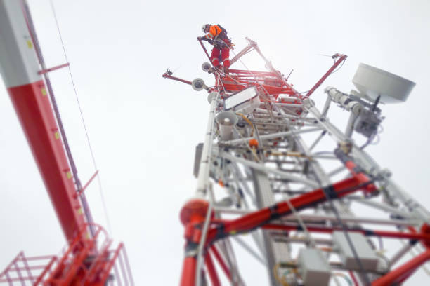 istock Rope access technician - electrician - working on top of the tower - antenna 1081590546