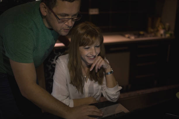 istock Couple at home with laptop 1081590894