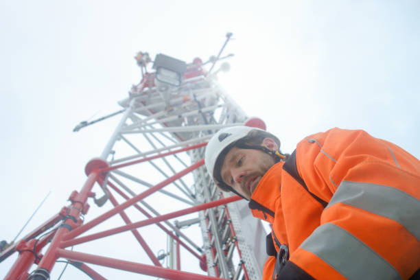 istock Charismatic Rope access technician finished job on the tower - antenna 1081591458