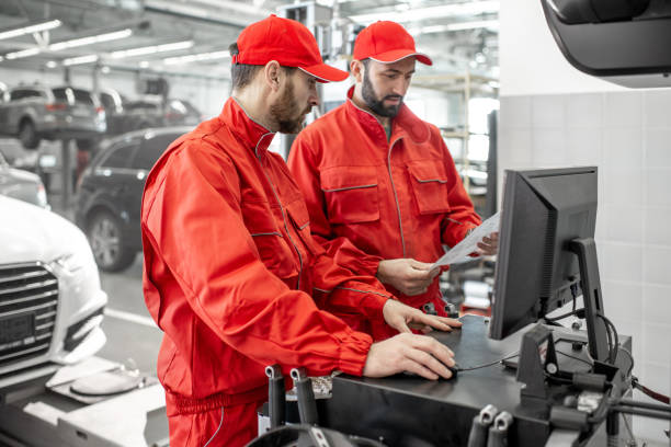 istock Auto mechanics serving luxury car at the car service 1081593816