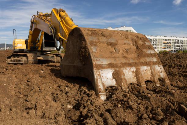 istock Earthmoving excavator preparing the construction site soil 1081596206
