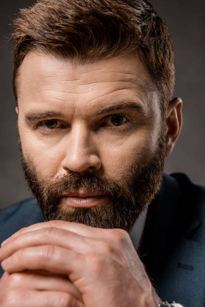 istock close up of handsome bearded man with praying hands 1081599108