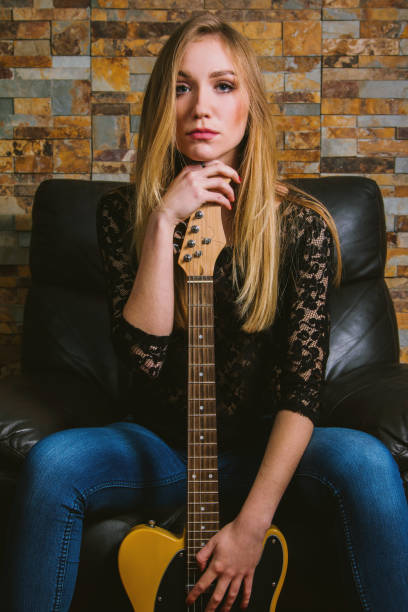 istock Girl posing with guitar 1081599622