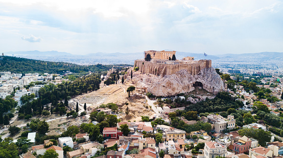 View of the Acropolis of Athens from the Areopagus, a hill located to the west of the Acropolis. The Acropolis is a UNESCO World Heritage Site and is home to some of the most iconic ancient Greek monuments, including the Parthenon, the Erechtheion, and the Propylaea.