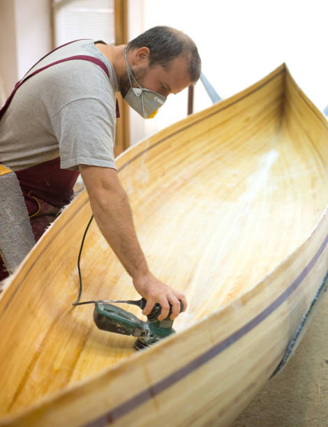 istock Carpenter making wooden boat 1081600278