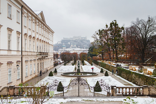 Salzburg, Austria - November 27, 2018: views to hohensalzburg fortress from mirabell gardens at winter landscape