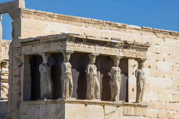 Caryatid at Acropolis A Caryatid is a sculpted female figure serving as an architectural support taking the place of a column or a pillar supporting an entablature on her head. acropole stock pictures, royalty-free photos & images