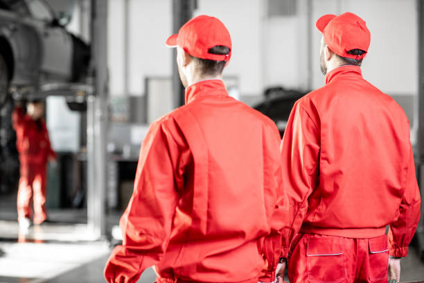 istock Auto mechanics standing back at the car service 1081607454