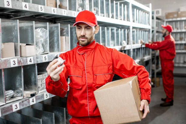 istock Man working at the warehouse with auto parts 1081608428