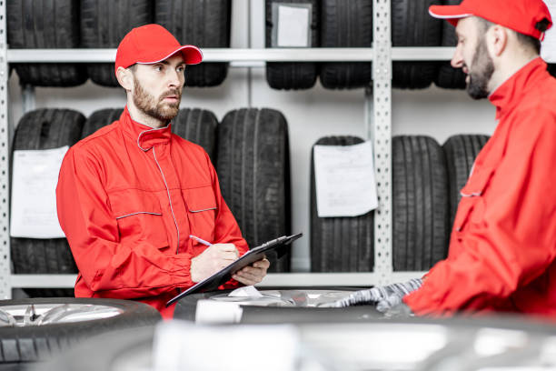 istock Men working in the warehouse with tires 1081609596