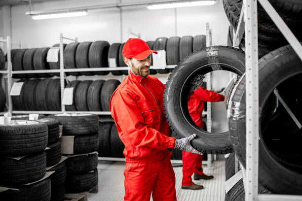 istock Men working in the warehouse with tires 1081609670