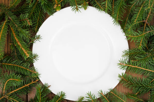 istock White plate and spruce branches for New Year and Christmas menu 1081610060