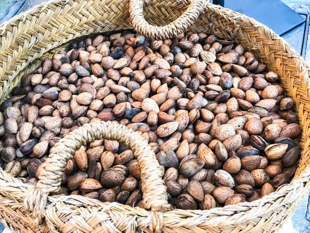 istock Unpeeled almonds in wicker basket 1081610636
