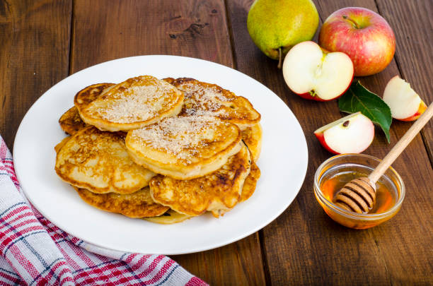 istock Hot fried pancakes with apples and honey 1081612348