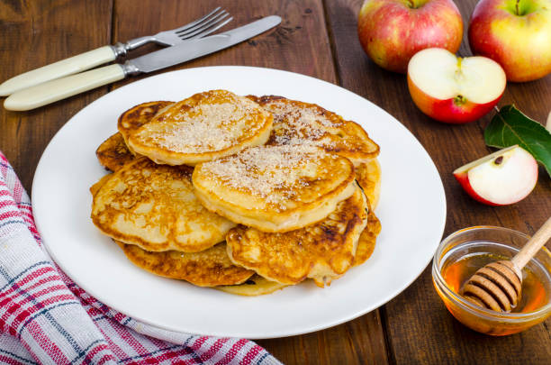 istock Hot fried pancakes with apples and honey 1081612372