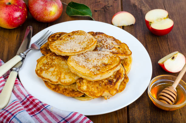 istock Hot fried pancakes with apples and honey 1081612378