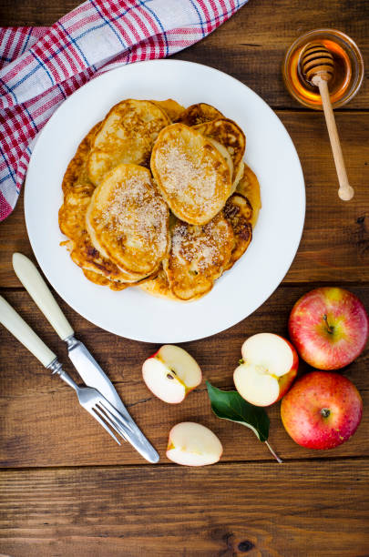 istock Hot fried pancakes with apples and honey 1081612382