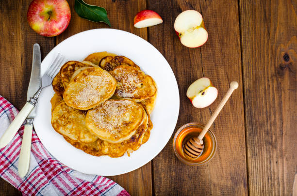 istock Hot fried pancakes with apples and honey 1081612386