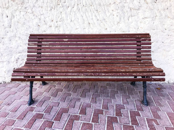 istock Vintage wooden bench on stone background 1081613860