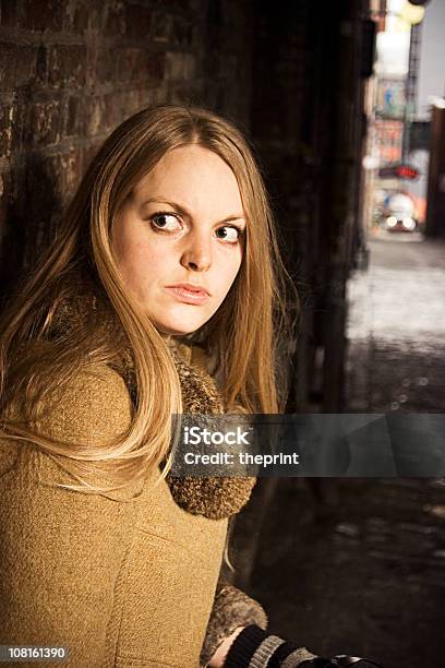 Scared Young Woman Stock Photo - Download Image Now - Fear, One Woman Only, Escaping