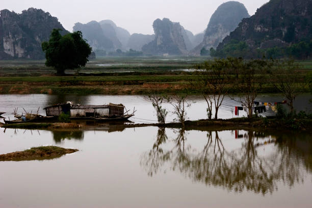 Boat on river in Ninh Binh, Vietnam. Beautiful asian landscape.