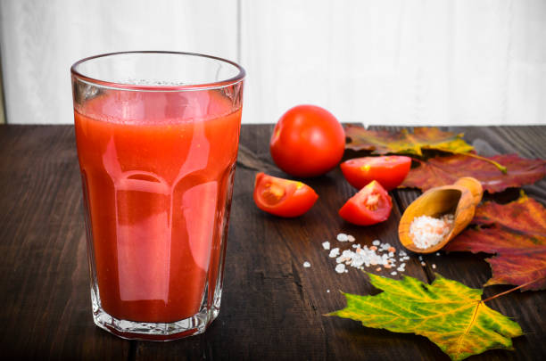 istock Natural juice with pulp from fresh ripe red tomatoes 1081615160