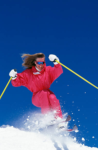 istock Beautiful Woman Snow Skiing 108161648