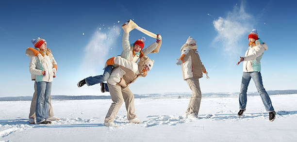 Brother and sister having fun during snowfall in Erzurum, Turkey. A joyful winter moment showing family love, childhood happiness, outdoor fun, and the beauty of snowy weather. kids.