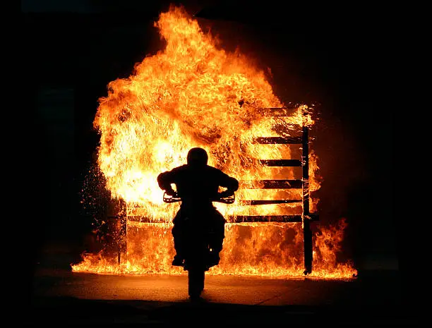 Photo of Motorbike driving through wall of fire