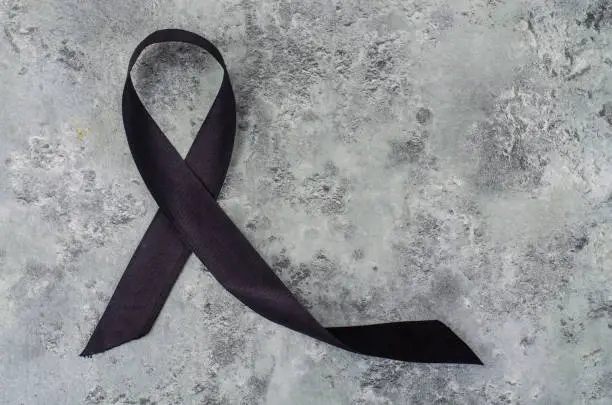 Photo of Symbolic black ribbon, awareness of melanoma