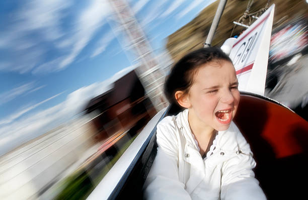 istock Blurred Motion, Little Girl Having Fun on Amusement Park Ride 108161931