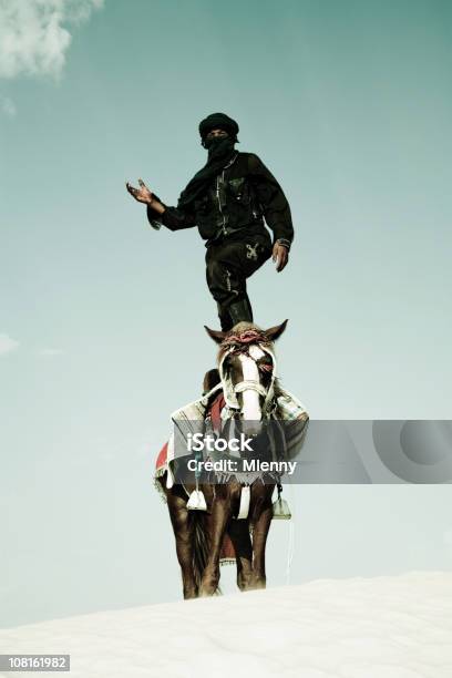 Tuareg Standing On Horse In Sand Dune Stock Photo - Download Image Now - Bedouin, Men, Horse