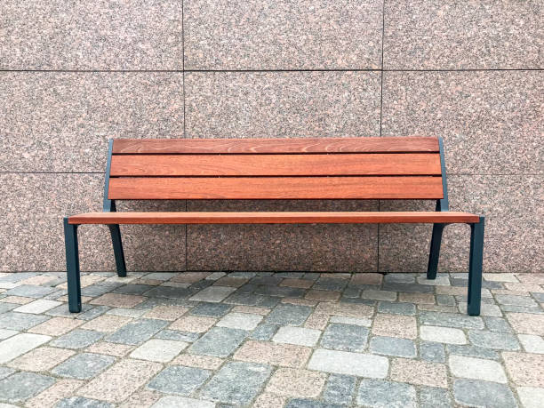istock Wooden bench on street on pavement 1081620290