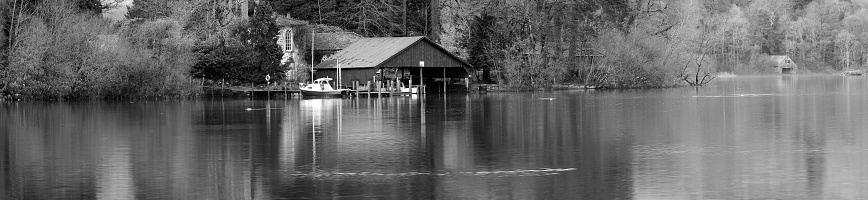 Monochrome image of luxury private island with wooden boathouse and launch. Adobe RGB 1998 color profile.\n\n[b]See many more great landscape images in this lightbox:[/b]\n\n[url=http://www.istockphoto.com/search/lightbox/300969][img]http://www.fotovoyager.com/istock/lightbox_horizons.jpg[/img][/url]\n\n[b]See more great urban, rural and wilderness panoramic images in this lightbox:[/b]\n\n[url=http://www.istockphoto.com/search/lightbox/384048][img]http://www.fotovoyager.com/istock/lightbox_panoramas.jpg[/img][/url]\n\n[b]See more great images of the Lake District in this lightbox:[/b]\n\n[url=http://www.istockphoto.com/my_lightbox_contents.php?lightboxID=835596][img]http://www.fotovoyager.com/istock/lightbox_lake.jpg[/img][/url]