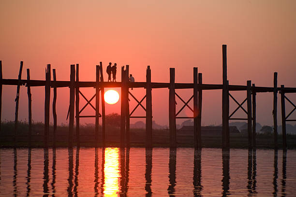 istock Myanmar: Crossing U Bein Teak Bridge at Sunset 108162381