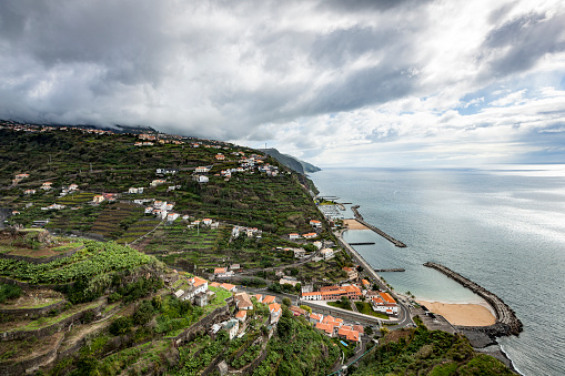 natural swimming pool and harbor at praia da calheta coastline at madeira island in portugal