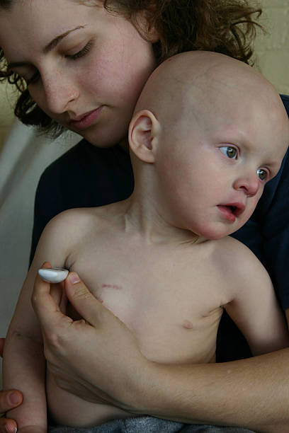 Cancer Kids; baby having temperature taken stock photo